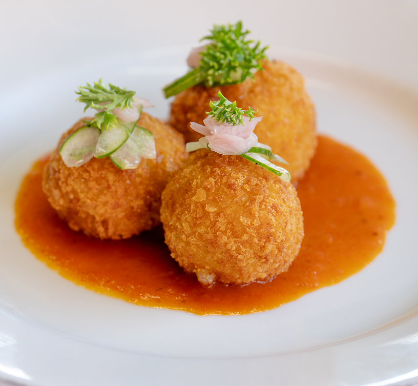 Close-up of croquettes with sauce